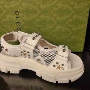 Gucci aguru white leather with mesh sandals and silver studs.